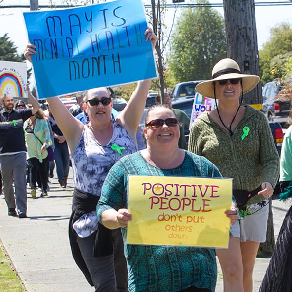 Participants of the 2017 Mental Health Walk march to the courthouse.