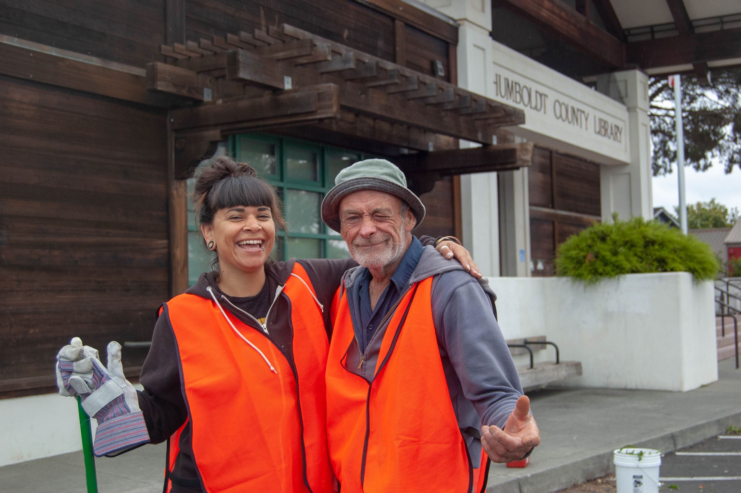 Helping Humboldt participants Kirstie Wright and Ross Lewis, both of Eureka, stand in front of the H