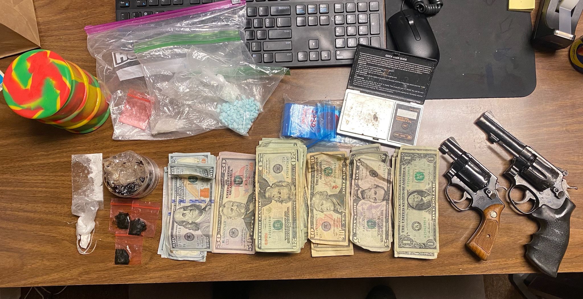 Drugs, cash, guns seized during traffic stop