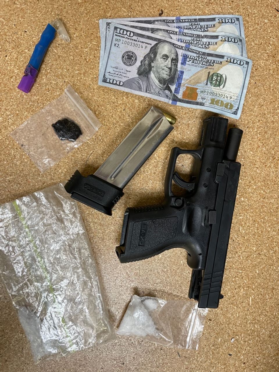 Gun, counterfeit money, and drugs located during traffic stop