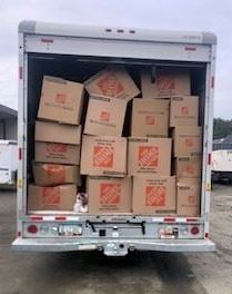 Uhaul truck filled with boxes of cannabis
