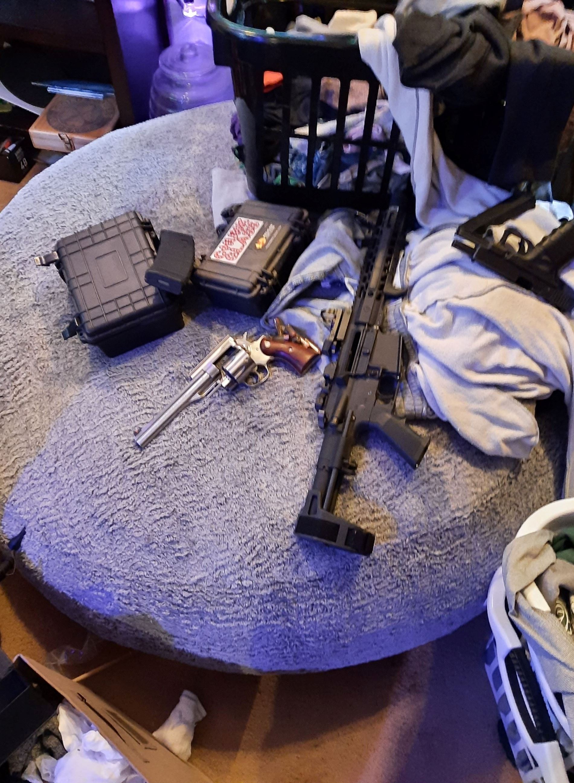 Three firearms, including one assault rifle