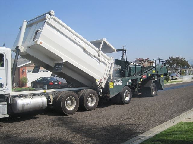 Chip Spreader applying crushed rock