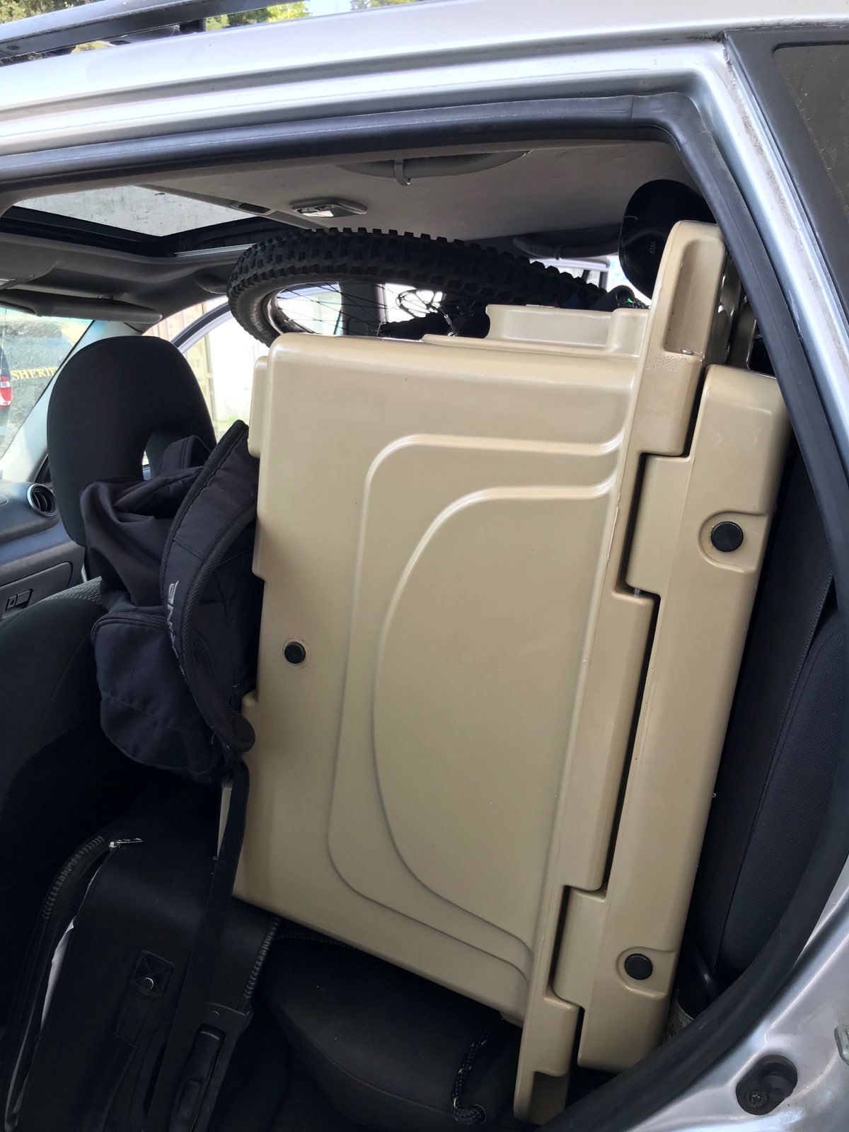 Suspected stolen cooler and other items in a stolen vehicle